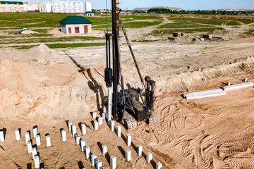 Pile driving machine. Diesel hammer pile driving machine working on construction site. Preparation...