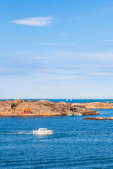 Boat on a rocky archipelago at summer