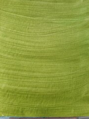 Olive background painted with a brush. Horizontal stripes from the pile of the brush.