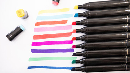 Colorful markers on a white background. Shallow depth of field.