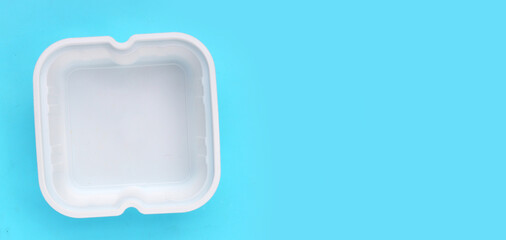Plastic food packaging on blue background.