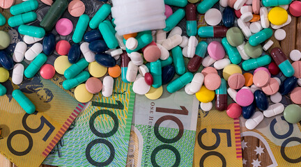 Colorful tablets with container and australian dollars