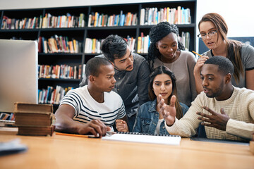 Students in library, studying together and discussion, exam or research for project, education and teamwork. Diversity, young men and women in study group and learning with collaboration on campus