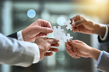 Solution, puzzle and group of people hands for business goals, project integration and workflow or...