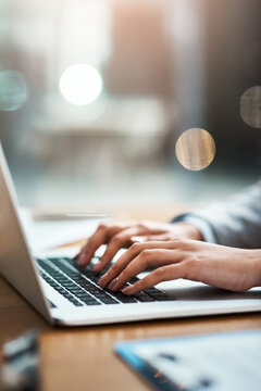 Laptop, typing and hands of a person at desk for work, internet and connection at night. Business, corporate and a secretary or receptionist on a computer keyboard for late admin online in an office