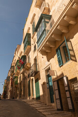 Old colored windows and a balcony in the old town. Malta