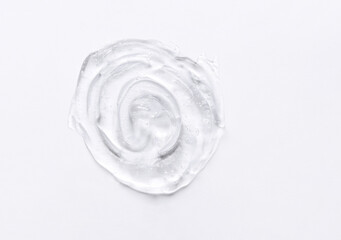 Gel texture of the emulsion on a white background. Clear cream swatch.