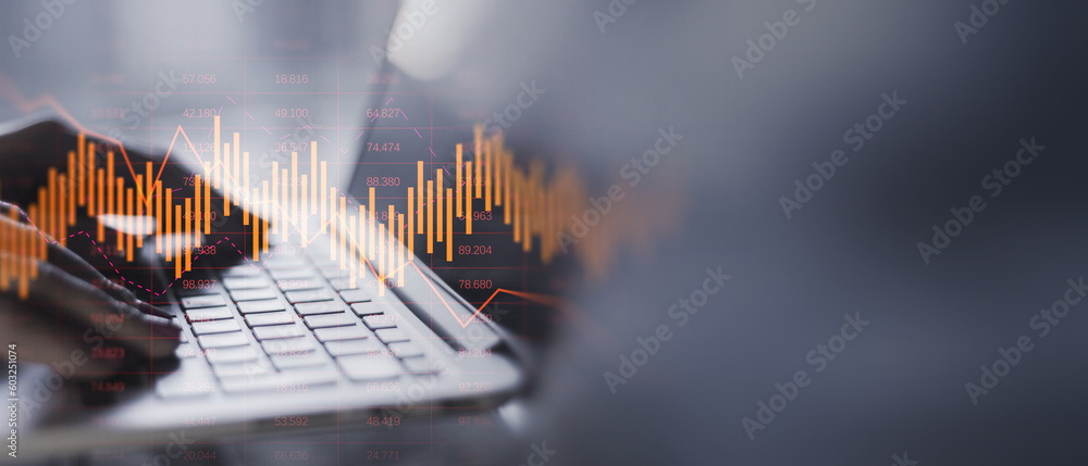 Aufkleber close up of hands using laptop with glowing downward business chart on blurry wide perspective backg