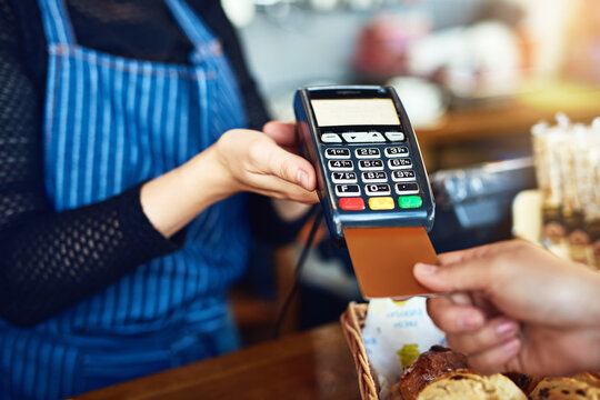 Credit card payment, cafe and hands with a machine at a restaurant for a service or food. Bakery, pay and a customer paying or buying a product at a coffee shop with a transaction from a worker