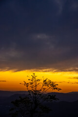 Plakat colorful magnificent sunset in countryside above hills and fields, beauty nature background