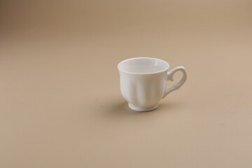 white cup of coffee on the table, isolated, copy space