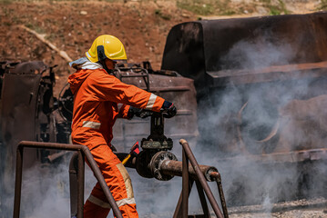 Fototapeta premium The firefighter's holding an iron ax exudes strength and determination as they prepare to tackle the challenging task ahead amidst the hazardous environment.