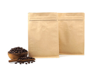 Two brown craft paper bag with vacuum-sealed, zipper, wooden bowl, scoop for packaging roasted coffee beans template isolated on a white background. Package mock-up for coffee or dry seeds product...