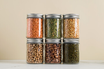 Different types of legumes in glass jars. Vegetable protein, healthy nutrition. Vegetarianism.