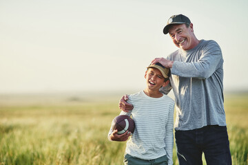 Father, kid fun and rugby portrait in a countryside field for bonding in nature. Mockup, dad and...