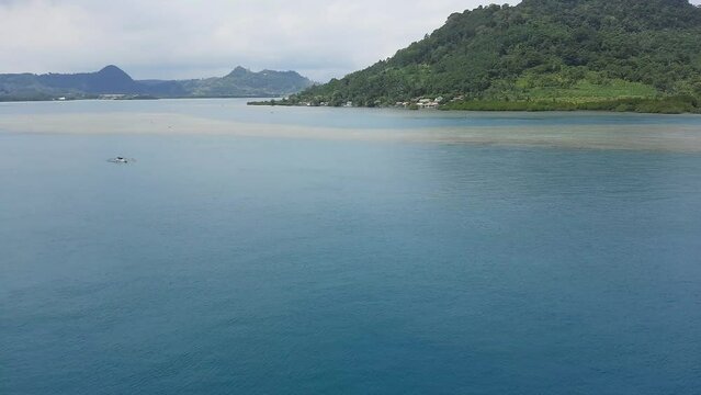 calm ocean currents during the day, beautiful island views in the port of Merak, Banten Indonesia