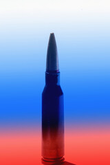 Conceptual image: war and aggression of russia, armed conflict. Close up cartridges with bullets against flag of russia background. Selective focus on first cartridge. Vertical image.