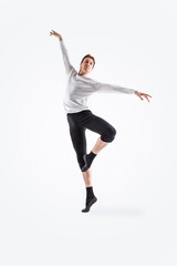Fototapeta na wymiar Young, handsome, sporty and athletic ballet dance. Black and white image.