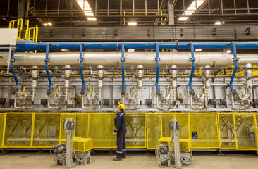 image of worker working in factory closed area