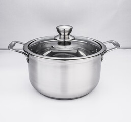 Stainless steel tableware and kitchen utensils placed on the desktop