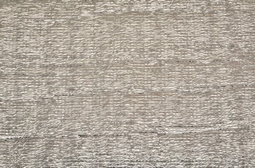 Silver foil texture. Rough wrinkle aluminium background with some reflections and highlights.