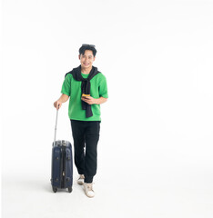 Happy young Asian man tourist man holding passport and plane ticket, make peace sign joyful with baggage going to travel on holidays isolated on white copy space background
