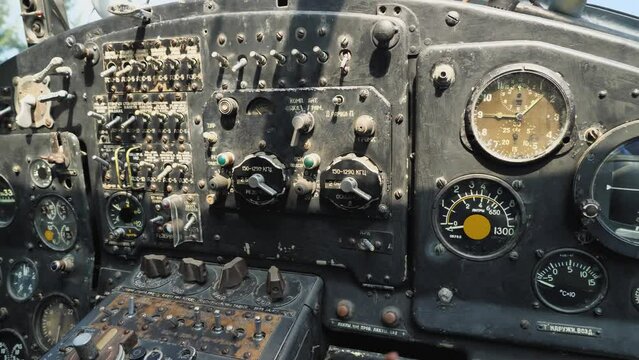 Close-up of the instrument panel of the old Soviet An-2 aircraft. Sensors, toggle switches, levers and analogue instruments. Inside the cabin of aircraft An-2