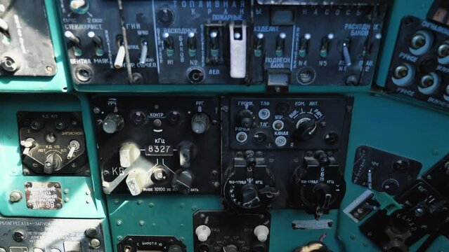 Inside the cockpit of the Mi-24 military transport helicopter. Close-up view of the control panel, instruments, tumblers and other controls. Russian military helicopter