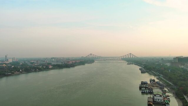 Kolkata: Aerial view of city in India, boats on river Ganges (Hooghly River) - landscape panorama of South Asia from above
