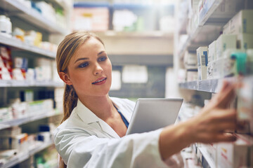 Medicine, woman pharmacist with tablet and looking for prescription in an isle at the pharmacy or clinic. Healthcare, pharmaceutical and female person search for medication with digital device - Powered by Adobe