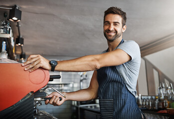 Man in cafe, machine for coffee and barista, prepare caffeine drink with process and production in hospitality industry. Service, male waiter working on espresso in restaurant and smile in portrait