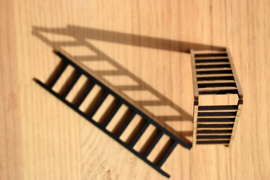 Close-up of Stair against wood background