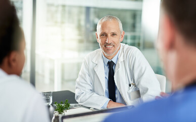 Portrait, man and doctor with team in office for meeting, clinic collaboration and leadership of...