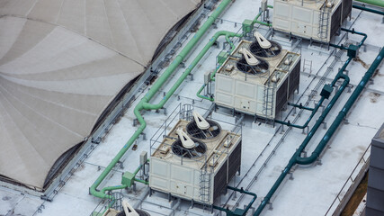 Cooling towers in data center building. Air conditioning cooling towers in front of building with...