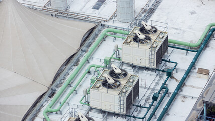 Cooling towers in data center building. Air conditioning cooling towers in front of building with...