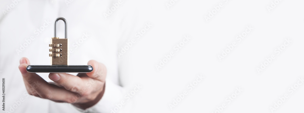 Canvas Prints man holding smartphone with a padlock. smartphone security