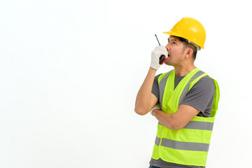 Portrait of male construction worker wearing hard hat holding construction walkie talkie isolated on white background Copy space over a white studio background.