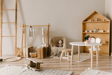 Stylish Scandinavian-style children's room interior with handmade wooden products © ksyusha_yanovich