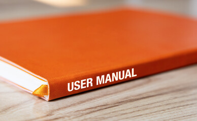 User manual book on wooden table