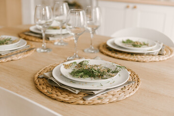 Kitchen white wooden kitchen with Scandinavian-style dining area decorated with mimosa