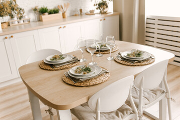 Kitchen white wooden kitchen with Scandinavian-style dining area decorated with mimosa