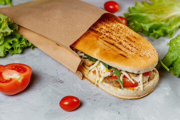 panini sandwich with crispy chicken and rucola salad