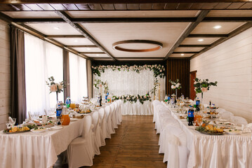 Wedding decor, decoration of the newlyweds' table with flowers