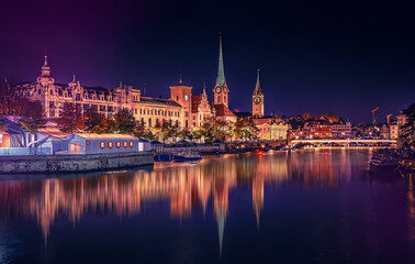 Fototapeta na wymiar Evening panoramic view of historic Zurich city center with famous Fraumunster and river Limmat at Lake Zurich. Cityscape image of Zurich with reflection. Switzerland
