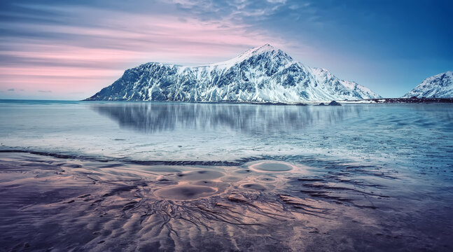 Stunning winter scenery on Skagsanden beach during sunset. Vivid nature of Lofoten islands. Norway