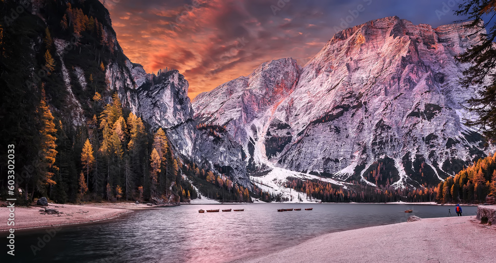 Fototapete Incredible view on majestic famouse lake Braies in autumn season. Wonderful sunny landscape in dolomites Alps with colorful sky. Amazing nature Scenery. Lake Braies is also known as Lago di Braies