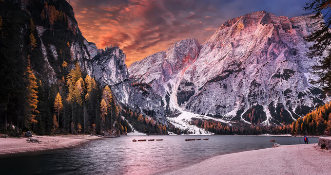 Incredible view on majestic famouse lake Braies in autumn season. Wonderful sunny landscape in dolomites Alps with colorful sky. Amazing nature Scenery. Lake Braies is also known as Lago di Braies