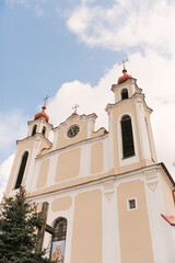Fototapeta premium Ancient stone Catholic church decorated with small mosaics and icons, Osova, Belarus, 2023