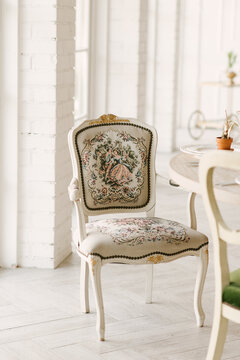 White vintage chair with hand embroidery
