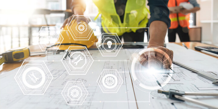 engineer analyze data working and tablet, laptop with on on architectural project at construction site at desk in virtual icon diagram